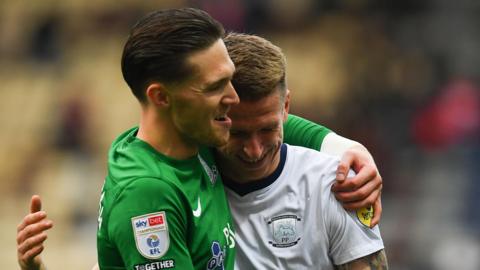 Freddie Woodman (left) hugging Emil Riis after a Preston match