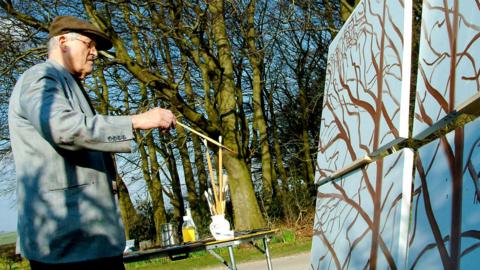 David Hockney painting outdoors