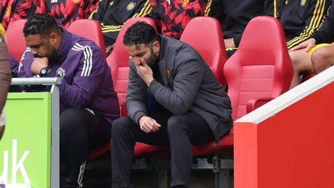 Manchester United head coach Ruben Amorim looks at the ground