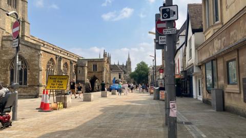 Church Street with no cars signs and CCTV signage 