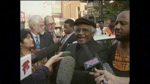 Archbishop Desmond Tutu speaks to reporters.