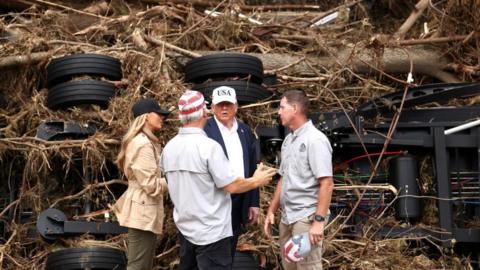 Melania and Donald Trump survey flood damage in Texas with local officials