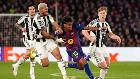 Joelinton battles Lamine Yamal for the ball during Newcastle United's game against Barcelona at the Nou Camp on 18 March, 2026
