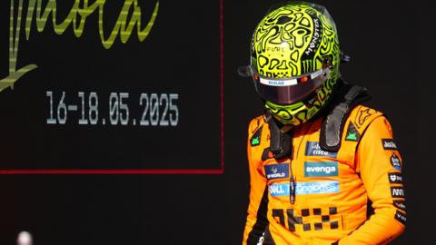 Lando Norris heading back to the McLaren garage after qualifying.