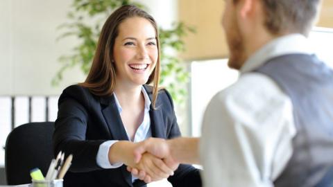 woman and man shaking hands