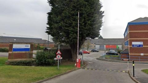 The entrance of the Humber and North Yorkshire Integrated Care Board, with a sign, a speedbump and a barrier