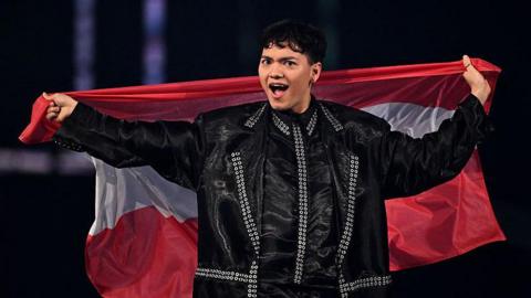 JJ holds aloft an Austrian flag
