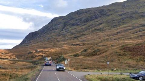 A Google Map's image of the area where the accident happened. There is the A82 and junction with car park. A rocky hillside is in the background.