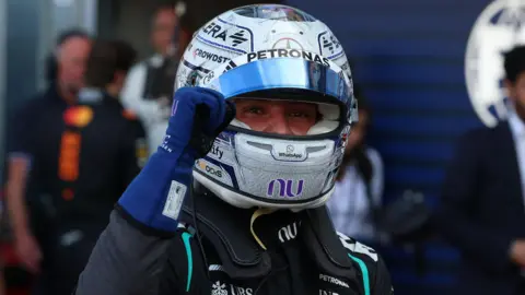 Kimi Antonelli clenches his fist in celebration after taking pole for position for the Monaco Grand Prix