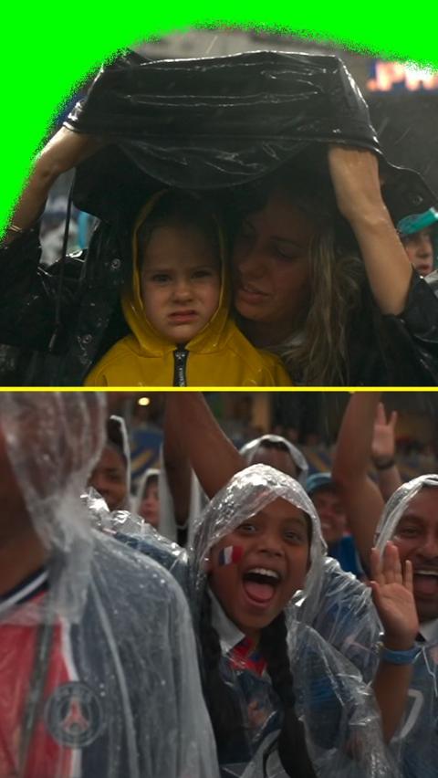 Fans sheltering form the rain 