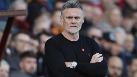 Bradford City boss Graham Alexander watches on