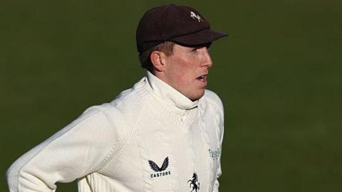 Zak Crawley in the field with his Kent cap on