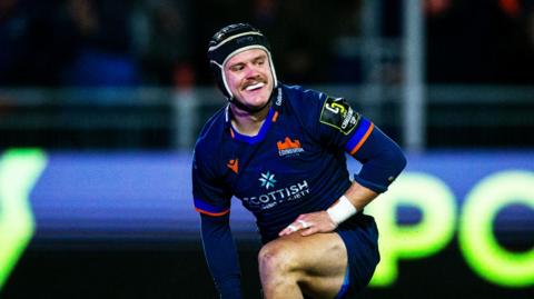 Darcy Graham smiles after scoring Edinburgh try