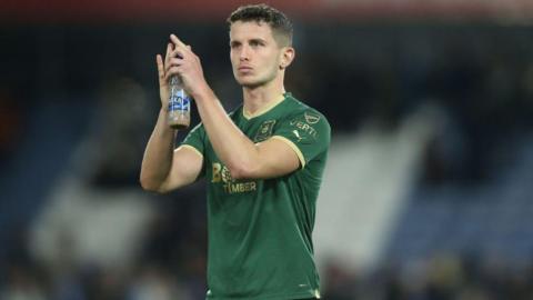 Jordan Houghton applauds the Plymouth fans 