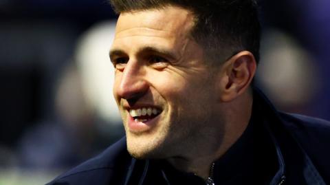 A smiling Portsmouth boss John Mousinho