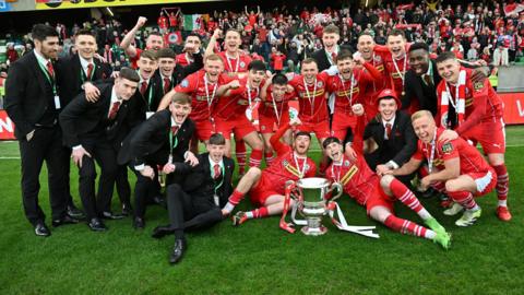 Cliftonville players celebrate winning the Irish Cup