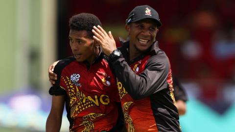 John Kariko of Papua New Guinea celebrates the wicket of Nicholas Pooran of West Indies during the ICC Men's T20 Cricket World Cup West Indies & USA 2024 match