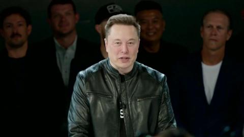 Elon wears a black leather jacket while speaking ahead of the SpaceX IPO.