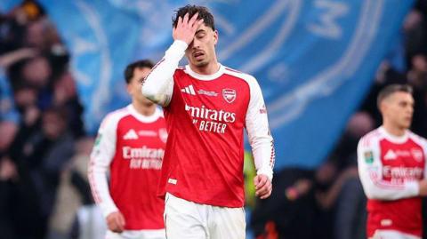 Arsenal players look disappointed by Manchester City loss in League Cup final