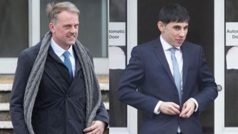 Two men - one blonde, one with black hair - pictured wearing navy suits, white shirts and blue ties. 