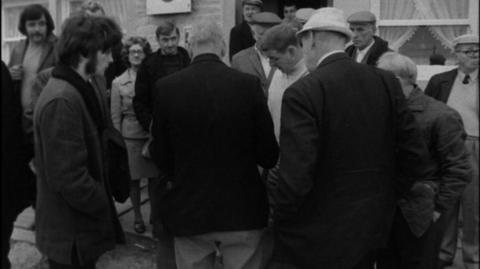 People in Greetland, West Yorkshire, gather around in preparation to play Knur and Spell.