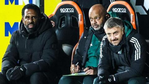 Celtic manager Wilfried Nancy (left) and his coaching team at Tannadice