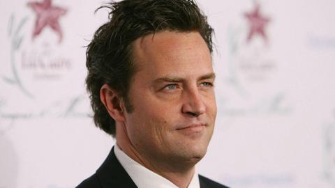 Friends star Matthew Perry is seen in a black suit 