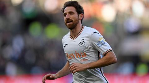 Joe Allen in action for Swansea