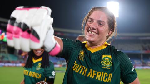 South Africa all-rounder Nadine de Klerk punches her glove out in celebration after victory over India