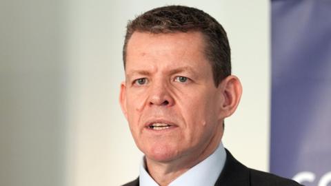 Rhun ap Iorwerth wearing a dark suit and a white shirt.