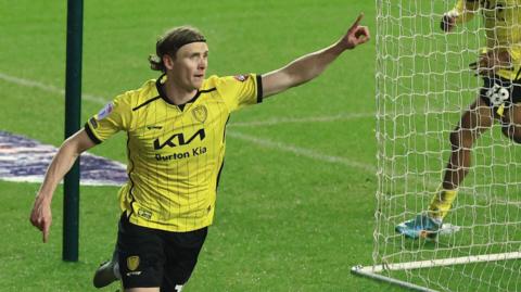 Jon Dadi Bodvarsson celebrates scoring for Burton at Wigan