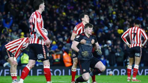 Sunderland players look dejected after their late defeat by Leeds