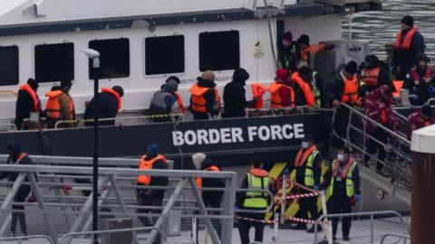 A group of people thought to be migrants are brought in to the Border Force compound in Dover, Kent, from a Border Force vessel following a small boat incident in the Channel.
