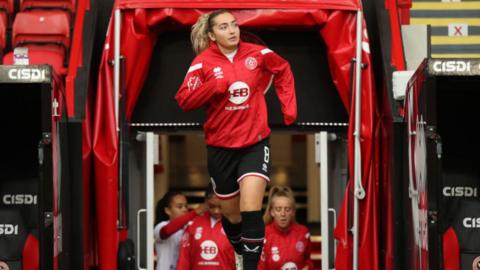 File image of Maddy walking out into the pitch for warm ups