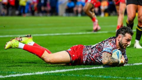 Gareth O'Brien crashes down with the ball to score a try for Leigh at the York Community Stadium