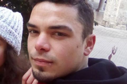 Close-up of Leonard Farruku looking at the camera. He has smartly cropped dark hair and a stubble goatee beard and has a serious expression.