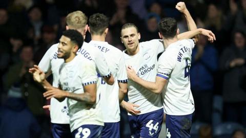 Preston players celebrate with goalscorer Brad Potts