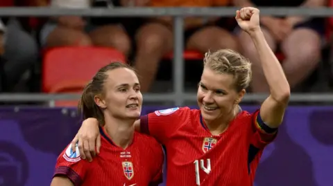 Oona Sevenius of Finland celebrates scoring her team's first goal with teammate Linda Saellstroem
