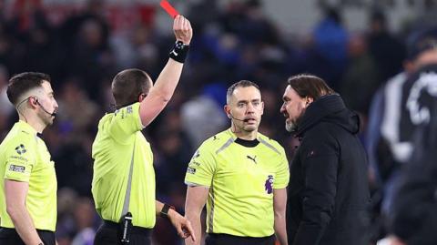 Daniel Farke is shown a red card by the referee