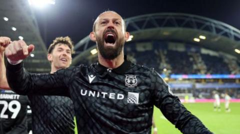 Wrexham striker Steven Fletcher celebrates