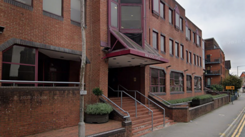 A Google Maps picture of Regents Gate in Reading, a three-storey office block on a roadside.