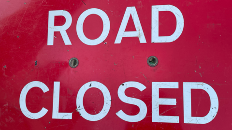 Sign reading 'Road Closed'