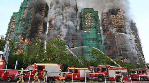 Efforts are underway to extinguish flames as fire engulfs high-rise residential buildings at the Wang Fuk Court complex on November 26, 2025 in Hong Kong, China.
