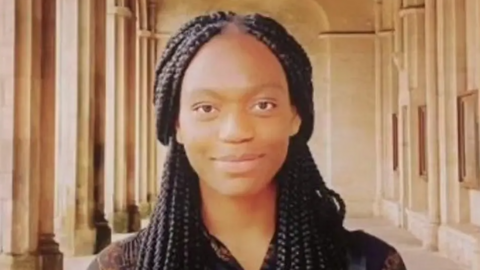 a previous picture of Stella Marris in the St Andrews University courtyard. She has long black braided hair