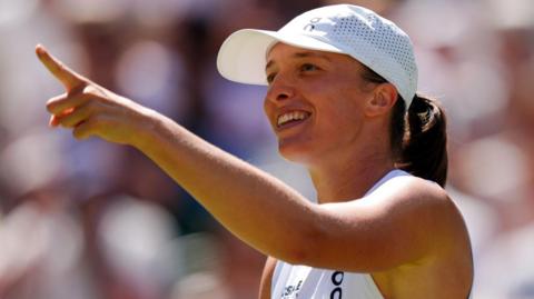 Iga Swiatek celebrates winning her second-round match against Karolina Pliskova