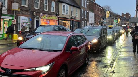 Stream of cars on Gillygate in York