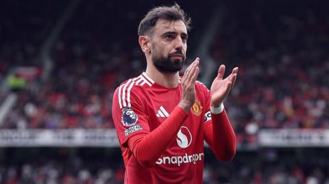 Bruno Fernandes applauding fans