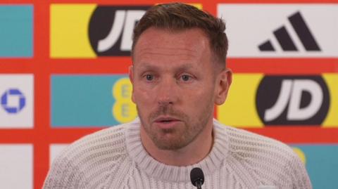 Craig Bellamy speaks to the media