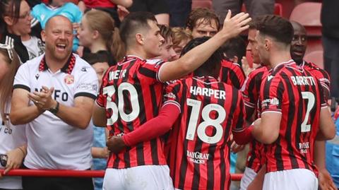 Walsall celebrate Harrison Burke's winner against Salford
