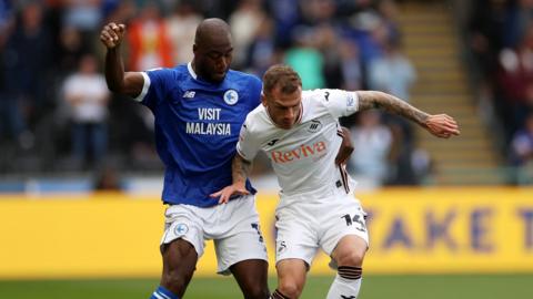 Cardiff City forward Yakou Meite battles with Swansea City left-back Josh Tymon